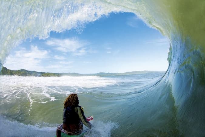 a men riding a wave