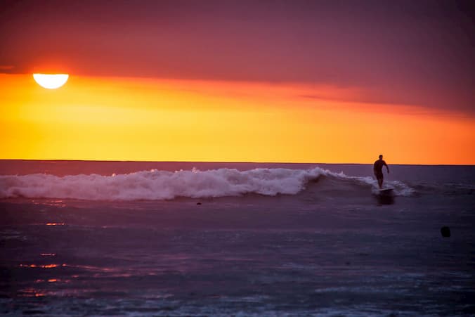 A sunset and the waves of Playa Guiones