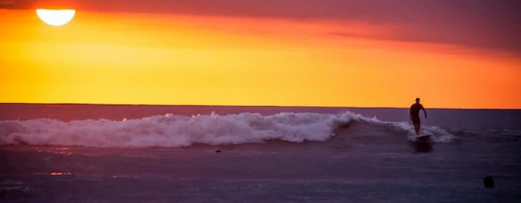 A sunset and the waves of Playa Guiones